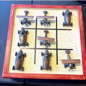 Tic-tac-toe game with copper planes and cars